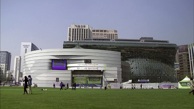 Film still from Jeong Jae-eun's 'City Hall', which tells the story of architect Yoo Kerl's struggles in designing the new Seoul city hall. Image from affr.nl.