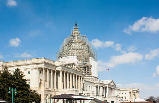 View of the United States Capitol building under renovation in 2015, Image courtesy of Wikimedia user Macieklew. 