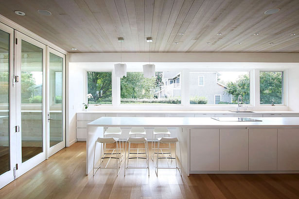 A Large Kitchen Island Anchors the Open Living Space