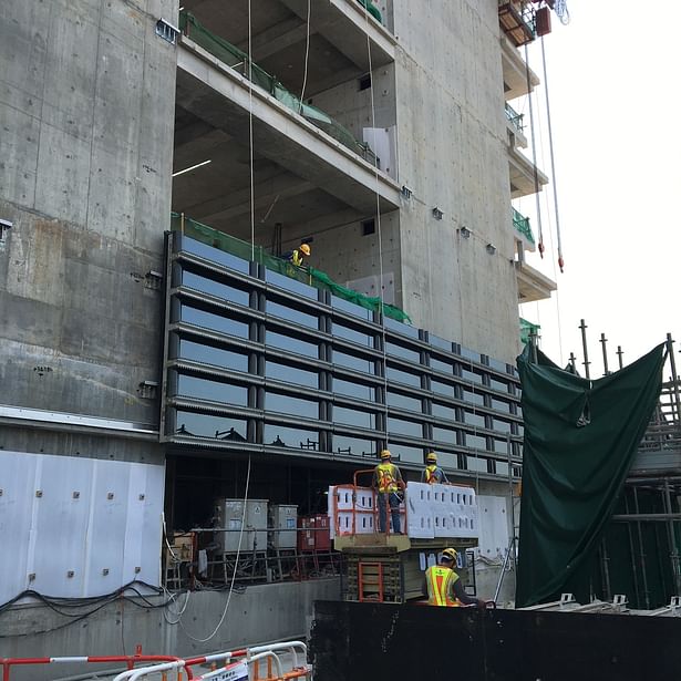 Installation of Sections of Facade