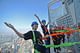 Look mom, 340 meters above the ground and no hands! (Image via shanghaiist.com)