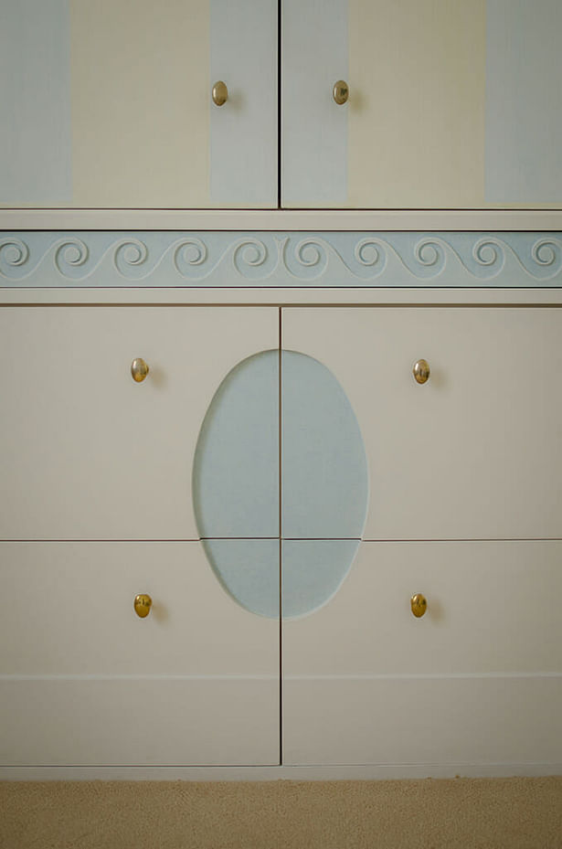 Custom bathroom cabinet, reflecting ceiling design.