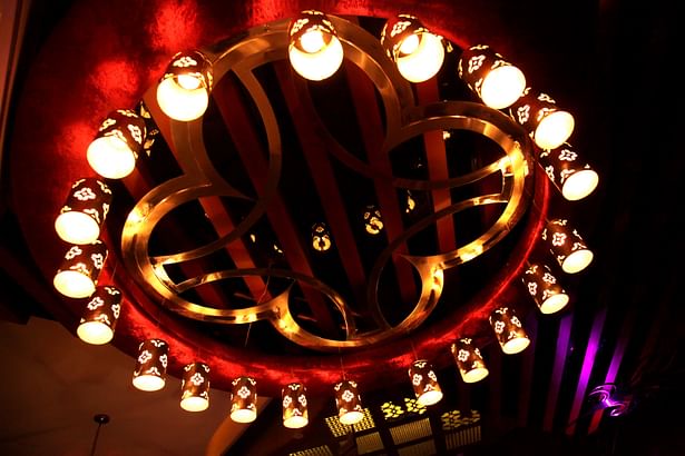 The Set of lamps around the ring bounding the quatrefoil motif in the ceiling of the waiting area
