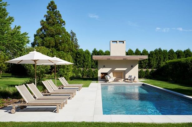 Stucco + mahogany pool house. Joshua McHugh Photography