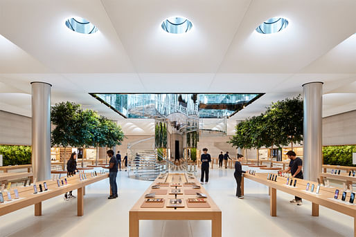 '18 mirror-glass Skylenses and 62 skylights flood natural light into the expanded store below the luminous glass cube.' - Photo courtesy of Apple