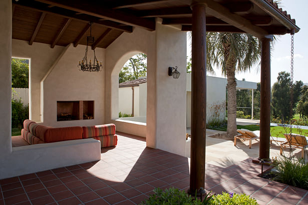 This covered outdoor patio area integrates the exterior and interior details.