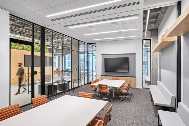 New meeting rooms reflect the 'new normal' of a post-COVID-19 world with robust IT/AV infrastructure to support hybrid in-person and at-home working formats. Photo Credit: Garrett Rowland