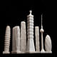 'Flammable' by architect Jingjing Naihan Li scales down the world's most celebrated skyscrapers into wax candles. Image via naihanli.com