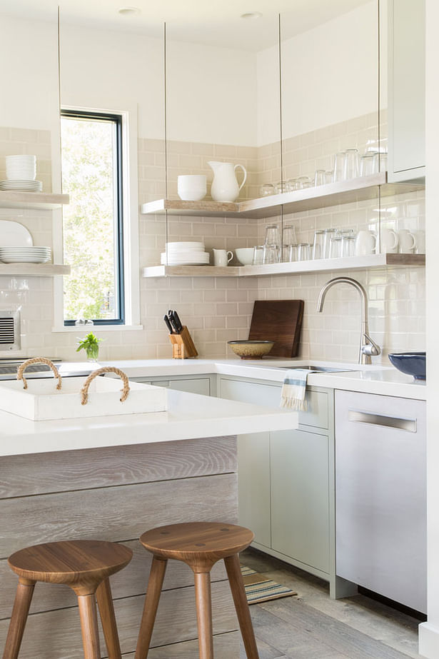 Details of the floating shelves that keep glassware and dishes at the ready for family and guests.