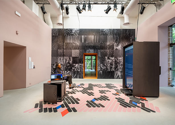 Felecia Davis, associate professor of architecture and director for the Computational Textiles Lab in the Stuckeman Center for Design Computing, sits in her Hair Salon exhibit that is part of the 2023 Venice Biennale in Italy through November. Image: Claudia Rossini