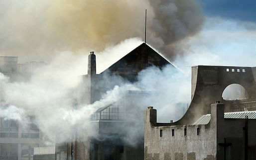 Charles Rennie Mackintosh's iconic Glasgow School of Art smoulders after catching fire on 23 May 2014. (Aeon; Photo by Jeff J Mitchell/Getty)