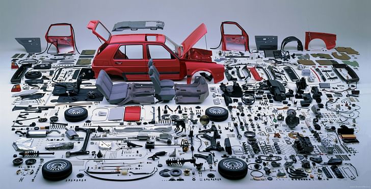 A dismantled VW Golf, ready to be put back together. Image by Hans Hansen, via twistedsifter.com
