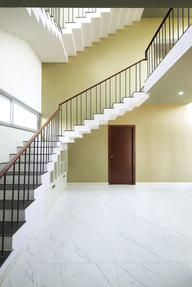 Staircase core and Court - The staircase core, located within the second court allows access to the upper floors of the house. Simple lines and clean edges that express dynamic geomtry of the staircase coupled with the general lack of dispensable ornamentation makes the minimal staircase a vision to behold. 