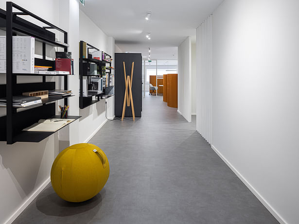 Shelving/library area overlooking the acoustic booth and hanger Photo: Ivo Tavares