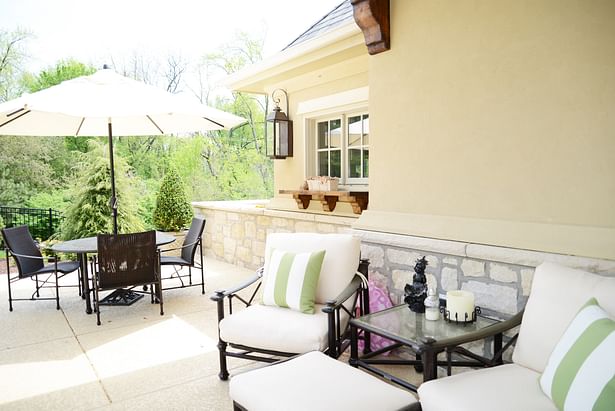 Outdoor lounging with views of the stone wainscoting and timber accents