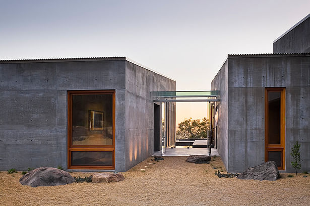 The entry shows the clear delineation between the home's two main volumes.