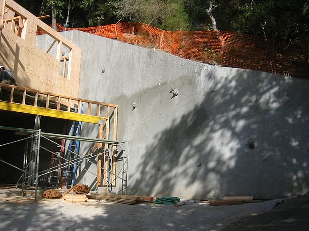 Tieback retaining wall the garage. 