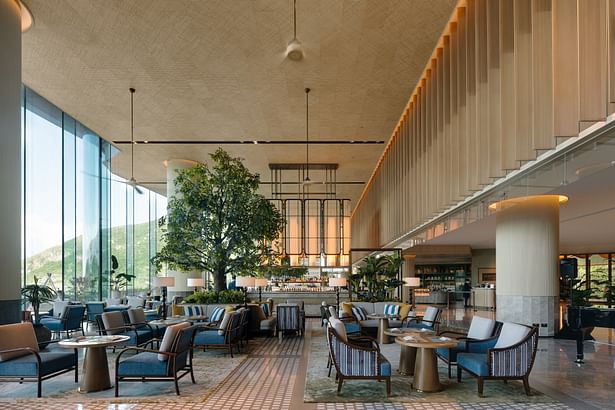 Double-height glass brings ample sunlight to the lobby 