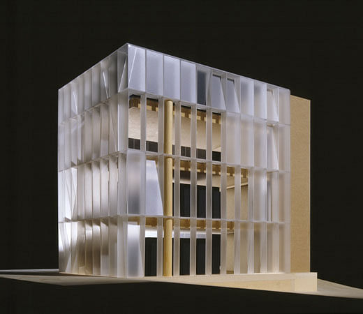 Model view, main facade. Freestanding structural glass facade with translucent & clear LCD panels, programmed to reflect binary digits of 0 and 1 and arranged to signify binary clocks for Tokyo, New York and Vienna. Interior view reflects 'no interior finishes' only concrete and glass. 