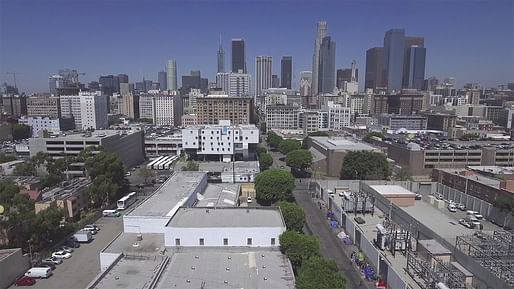 Still from Community by Design: Skid Row Housing Trust by Myles Kramer, showing the Michael Maltzan-designed Star Apartments for the Los Angeles Skid Row Housing Trust in the midground.