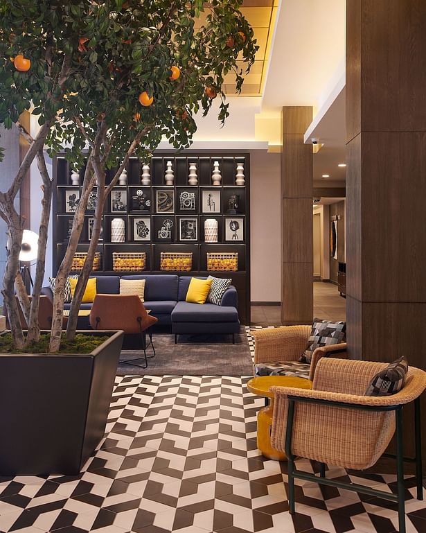 A 12-foot preserved orange tree sits proudly in the middle of the lobby as a tribute to the 15,000 acres of citrus groves that once blanketed the San Fernando Valley. (Photo credit: Sean Moore)