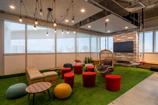 OMD Collaboration Area with swings and cosy furniture - comfortable office interior design