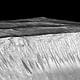 'Dark narrow streaks called recurring slope lineae emanating out of the walls of Garni crater on Mars. The dark streaks here are up to few hundred meters in length. They are hypothesized to be formed by flow of briny liquid water on Mars.' Credits: NASA/JPL/University of Arizona
