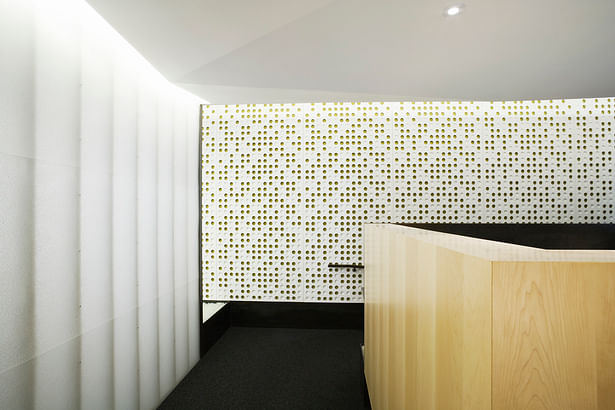 Custom acoustical panels line the space