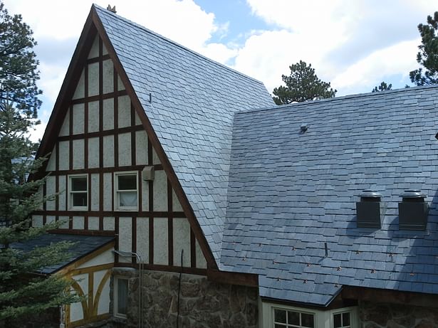 Natural slate roof, random length and random width supplied and arranged fitting.