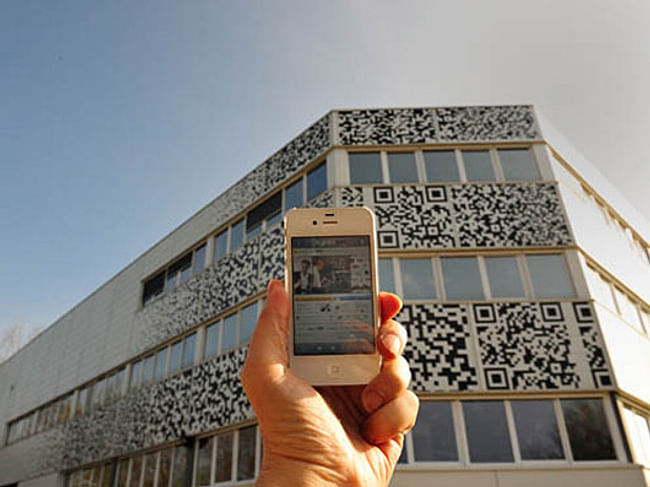 For budget reasons, the facade was extended and stickered with QR flashcodes. (Photo: MVRDV)