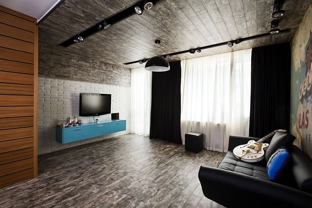 The EGGER laminate flooring on floor, wall, and ceiling makes the lounge cosy.