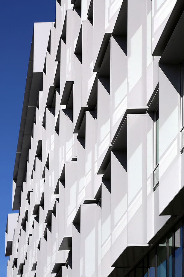 SOUTH-WEST FACADE: Result of the self-generation of the “honeycomb” solar shades set regarding the impacts studies (sun path illumination, contextual masks and thermal input).