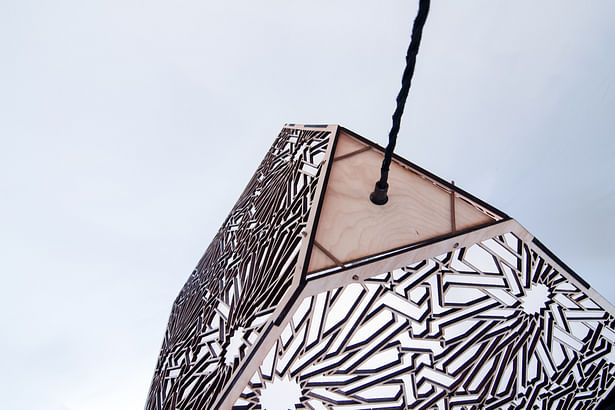 Detail of large laser cut pendant lamp by Smith Factory, LLC