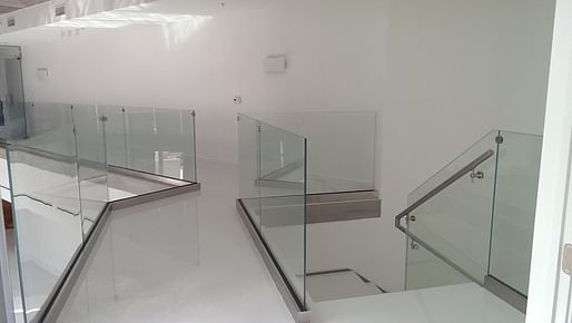 Clear Glass Railings Featuring Brushed Stainless Steel Elements