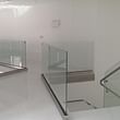 Clear Glass Railings Featuring Brushed Stainless Steel Elements