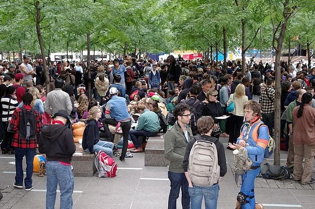 Zuccotti Park is home to two sculptures, including Mark di Suvero's Joie de Vivre, seen here in the background via Wikimedia Commons