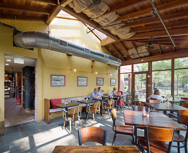 A conservatory addition provides additional inside dining.