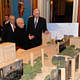 Frank Gehry and members of the Memorial Commission view model of Gehry's Eisenhower proposal. Image via carnageandculture.blogspot.com.