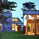 The Rifkind House in Wainscott, NY, a Long Island Modernist triptych pavilion clad in warm cedar siding, balanced with cool New York bluestone. Mahogany floor-to-ceiling window frames and custom-designed cherrywood furniture make the house an inviting and convivial entry into the pantheon of Modernist glass-walled houses. (Image via twbta.com)