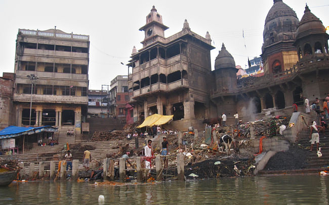 Manikarnika Ghat, her pile of charcoal, blackened temple and two eternal waiting rooms