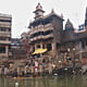 Manikarnika Ghat, her pile of charcoal, blackened temple and two eternal waiting rooms