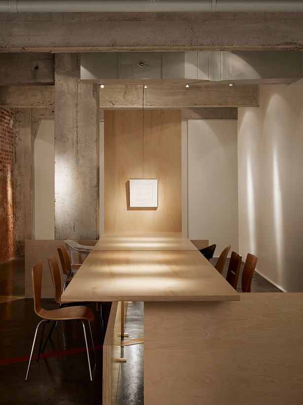 The Gallery seats a maximum of 10 surrounding a Baltic Birch slab table. The west end of the table is the focal point art for discussion. 