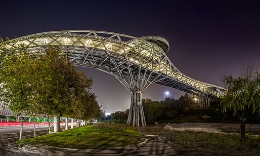 Tehran's new popular Tabiat bridge was designed by young architects Leila Araghian, Alireza Behzadi, and Sahar Yâsaei of Diba Tensile Architecture. (Photograph: Mohammad Hassan Ettefagh; Image via theguardian.com)
