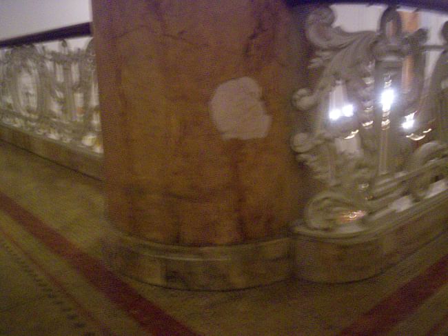 A low column of marble-faced plaster original to the Hotel located in the current 'Hotel Lobby' Mezzanine floor... The plaster is showing right through a hole in the marble! How disgusting!!!