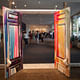 Visitors are welcomed in by the giant colorful McMansion doors that Koumoundouros refurbished surrounded by transparent walls. Photo by Marianne Williams.