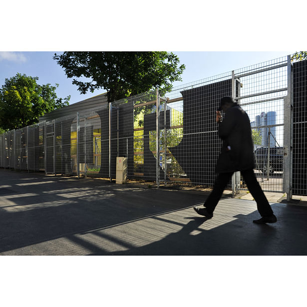 Trees, vegetation and giant letters are the facade of the site