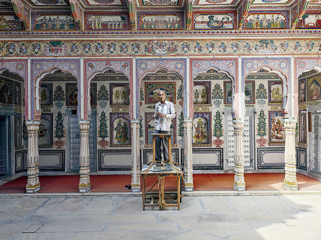 Built in 1902 and now a museum, Podar Haveli in Nawalgarh is one of the best-restored havelis in the region. Here, a painter does some touch-up work. Credit Nick Ballon