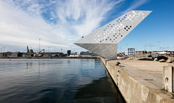 Perforated "Sailing Tower" spotlights Denmark's commercial Aarhus harbor