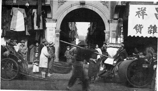 old pic of an entrance to a Longtang in Shanghai via Wikimedia Commons