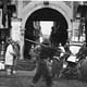 old pic of an entrance to a Longtang in Shanghai via Wikimedia Commons